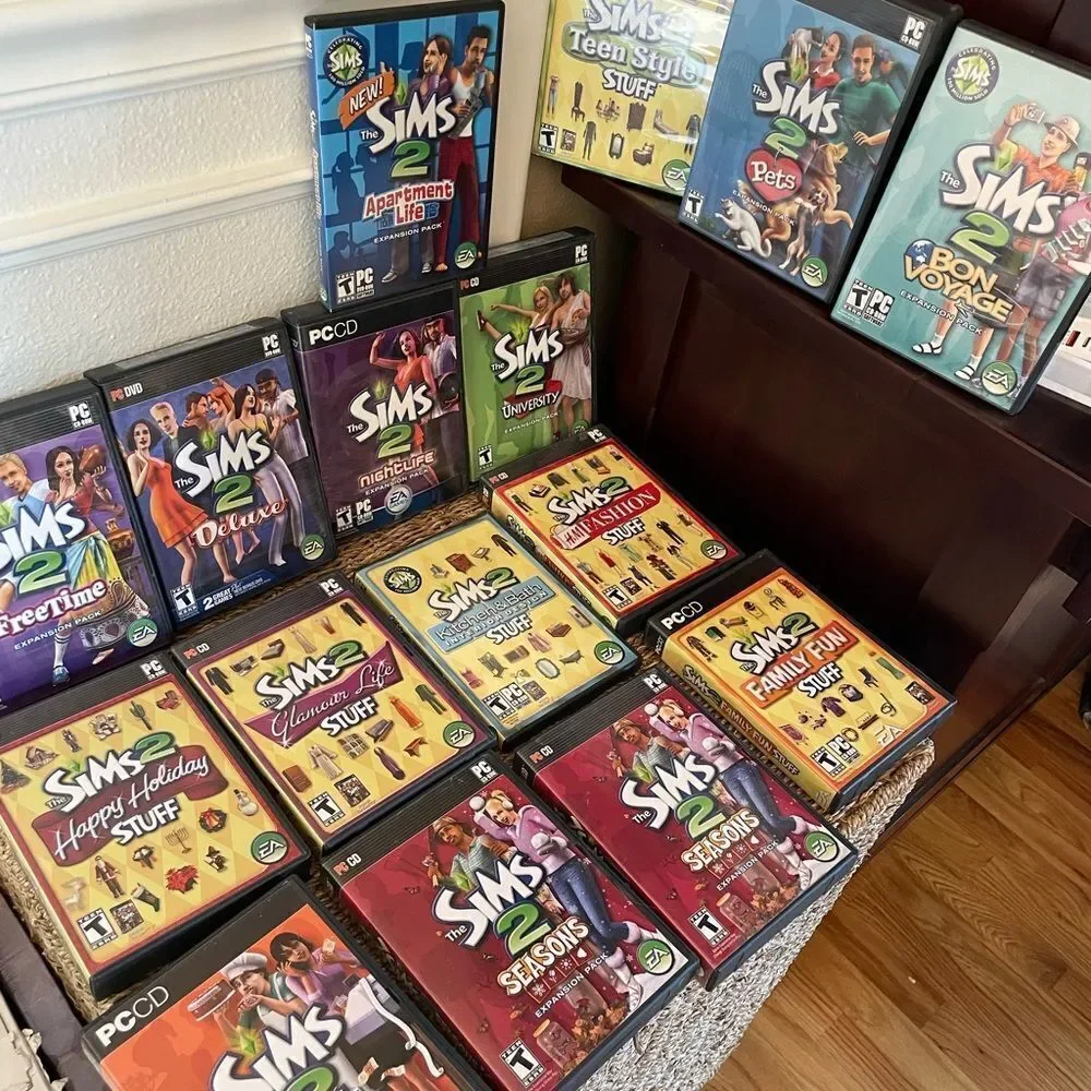 The SIMS PlayStation Vintage Side Video Game Lot PC DVD Pets Family Delux Sets
